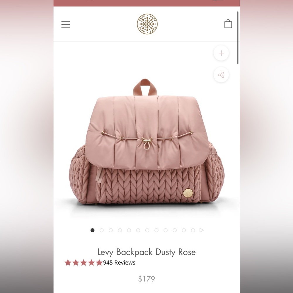 Happ baby diaper bag strap has original tie on it and zippers have plastic